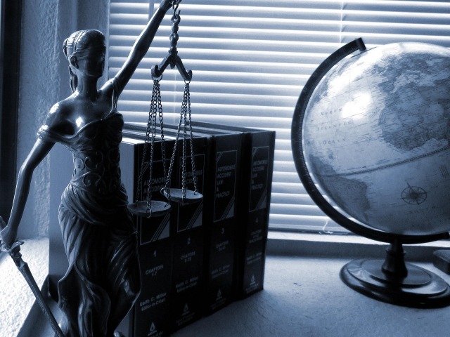 Lady Justice scales in law office